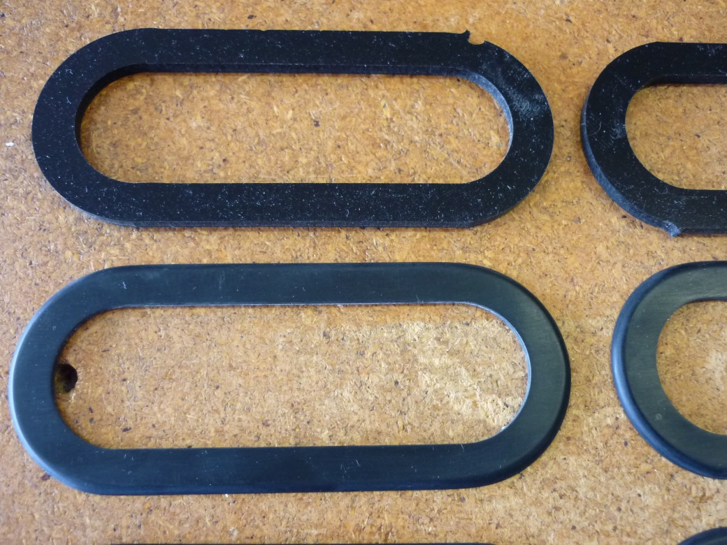 Closeup of the completed polished pickup surround 1.75mm thick and rounded edges. Mark's machined blanks is at top