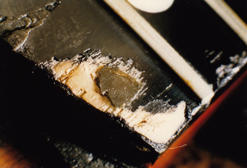 Close up of the wear and tear to the fingerboard at the 24th fret end