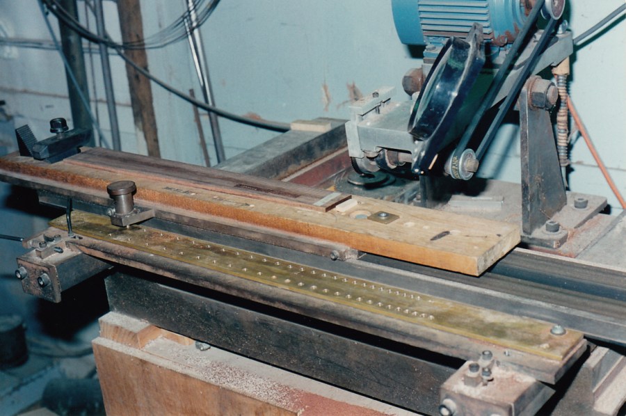 Brazilian rosewood fingerboard being slotted at Chris Kinman's workshop